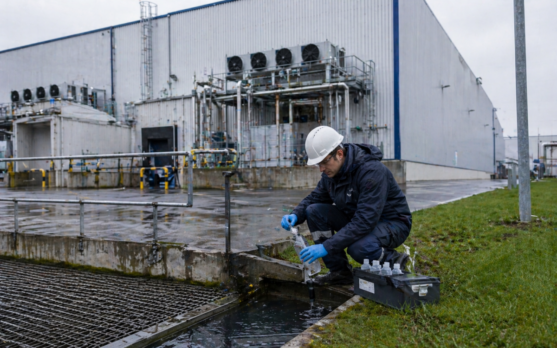 Industrial worker conducting water sampling
